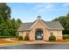 Charming pool house with brick accents, providing a relaxing retreat by the pool at 1014 Overlook Dr, Villa Rica, GA 30180