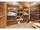 A custom wine cellar featuring extensive wooden racking and shelving for optimal wine storage at 1014 Overlook Dr, Villa Rica, GA 30180