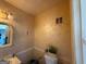 Traditional style bathroom with wallpaper and small vanity at 3346 Northcrest Rd # A, Atlanta, GA 30340