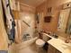 Full bathroom with shower and tub combination, vanity, and commode at 3346 Northcrest Rd # A, Atlanta, GA 30340