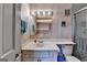 Tiled bathroom featuring a white vanity, commode, and enclosed shower at 3346 Northcrest Rd # A, Atlanta, GA 30340