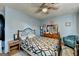 Comfortable bedroom with ceiling fan, wooden dresser, and lots of natural light at 3346 Northcrest Rd # A, Atlanta, GA 30340