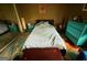 Bedroom with colorful dresser, area rug, and large bed with gray quilt at 3346 Northcrest Rd # A, Atlanta, GA 30340
