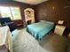 Bright bedroom offers a writing desk, dark accent wall and views to the outdoors at 3346 Northcrest Rd # A, Atlanta, GA 30340