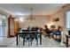 Bright dining room featuring wood-look flooring, a table with seating, and a chandelier at 3346 Northcrest Rd # A, Atlanta, GA 30340