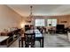 Traditional dining room with hardwood floors, chandelier lighting, and sunlit windows adds charm at 3346 Northcrest Rd # A, Atlanta, GA 30340