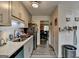 Modern kitchen featuring gray cabinetry, subway tile backsplash, stainless steel appliances, and wood-look flooring at 3346 Northcrest Rd # A, Atlanta, GA 30340