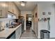 Efficient kitchen featuring gray cabinetry, sleek countertops, wood-look flooring, and modern appliances at 3346 Northcrest Rd # A, Atlanta, GA 30340