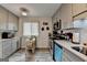 Charming kitchen with gray cabinetry, stainless steel appliances, and a cozy dining table by the window at 3346 Northcrest Rd # A, Atlanta, GA 30340