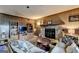 Cozy living room featuring a stone fireplace and wood paneling at 3346 Northcrest Rd # A, Atlanta, GA 30340