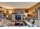 Living room with stone fireplace, wood paneling, and comfortable furniture at 3346 Northcrest Rd # A, Atlanta, GA 30340