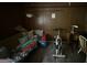Small room with wood paneling, excercise bike, desk, and couch at 3346 Northcrest Rd # A, Atlanta, GA 30340