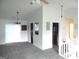Bright living area with neutral paint, plush carpet, and sliding glass doors at 4651 Garden Hills Dr, Stone Mountain, GA 30083