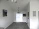 Spacious living area with neutral colors, plush carpet, and sliding glass doors for natural light at 4651 Garden Hills Dr, Stone Mountain, GA 30083