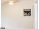 Bright and airy living room with a ceiling fan, vaulted ceilings, and a stylish art piece at 4651 Garden Hills Dr, Stone Mountain, GA 30083