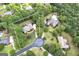 Aerial view of a wooded lot featuring a home with circular driveway at 715 Branchview Ct, Mcdonough, GA 30252