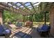 Covered patio area with outdoor seating, string lights, and a view of the backyard at 715 Branchview Ct, Mcdonough, GA 30252