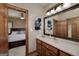 Bathroom boasting a vanity with mirror and a view into the main bedroom through a doorway at 715 Branchview Ct, Mcdonough, GA 30252