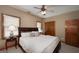 Cozy bedroom with neutral tones, carpet, ceiling fan and wood trim at 715 Branchview Ct, Mcdonough, GA 30252