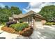 Brick home featuring manicured landscaping, side-entry garage, and a well-maintained lawn at 715 Branchview Ct, Mcdonough, GA 30252