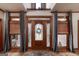 Inviting foyer with decorative glass front door and decorative accents at 715 Branchview Ct, Mcdonough, GA 30252
