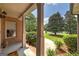 Front porch view showcasing brick columns and a glimpse of the landscaped yard at 715 Branchview Ct, Mcdonough, GA 30252