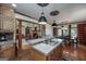 Spacious kitchen with granite countertops, stainless steel appliances, custom cabinets, and hardwood floors at 715 Branchview Ct, Mcdonough, GA 30252