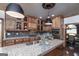 Well-equipped kitchen featuring granite countertops, custom cabinets, and stainless steel appliances at 715 Branchview Ct, Mcdonough, GA 30252