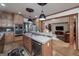 Gourmet kitchen featuring granite countertops, stainless steel appliances, a tile backsplash, and custom cabinets at 715 Branchview Ct, Mcdonough, GA 30252