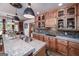 Lovely kitchen featuring granite countertops, custom cabinets, a tile backsplash, and hardwood floors at 715 Branchview Ct, Mcdonough, GA 30252