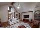 Inviting living room with vaulted ceiling, detailed trim, hardwood floors, and a stylish decorative rug at 715 Branchview Ct, Mcdonough, GA 30252