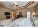 Large main bedroom boasting carpet flooring and an en-suite bathroom at 715 Branchview Ct, Mcdonough, GA 30252