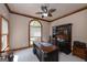 Charming office with large windows providing natural light, and classic dark wood furniture at 715 Branchview Ct, Mcdonough, GA 30252