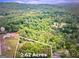 Aerial view of 2.62 acre lot surrounded by lush greenery; the perfect serene place to build your dream home at 1470 Dunn Rd, Cumming, GA 30040