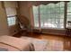 Comfortable bedroom with hardwood floors, ample natural light, and cozy decor at 1470 Dunn Rd, Cumming, GA 30040