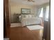 Serene bedroom with hardwood floors, a cozy bed, and pleasant natural lighting at 1470 Dunn Rd, Cumming, GA 30040