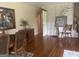 Spacious dining area with hardwood floors, wainscotting, and classic furnishings at 1470 Dunn Rd, Cumming, GA 30040