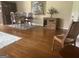 Classic dining room featuring hardwood floors, traditional wooden furniture, and decorative art at 1470 Dunn Rd, Cumming, GA 30040