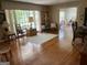Open-concept living area with hardwood floors, ample seating, and large windows at 1470 Dunn Rd, Cumming, GA 30040