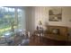 Sunlit living room with hardwood floors, comfortable seating, and a large window with a view at 1470 Dunn Rd, Cumming, GA 30040