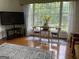 Bright living area features hardwood floors, cozy seating, and large windows with a view at 1470 Dunn Rd, Cumming, GA 30040