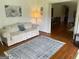 Living room with hardwood floors, area rug, and adjacent dining area at 1470 Dunn Rd, Cumming, GA 30040