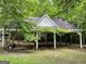 Open-air outbuilding covered in vines at 1470 Dunn Rd, Cumming, GA 30040