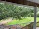 View from the porch of the landscaped yard with mature trees at 1470 Dunn Rd, Cumming, GA 30040