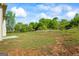 A large, empty backyard with green and brown grass, ready for landscaping or outdoor activities at 634 Gardner Rd, Stockbridge, GA 30281
