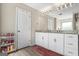 Bathroom with a double sink vanity, granite countertops, and white cabinets at 634 Gardner Rd, Stockbridge, GA 30281