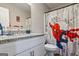 Bathroom featuring a granite vanity and a unique Spiderman-themed shower curtain for a fun design at 634 Gardner Rd, Stockbridge, GA 30281