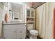 Bathroom features a granite vanity, toilet with storage, and shower curtain rod at 634 Gardner Rd, Stockbridge, GA 30281