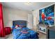 Spiderman themed bedroom featuring carpet, neutral walls, and a comfortable bed with themed bedding at 634 Gardner Rd, Stockbridge, GA 30281