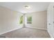 Empty bedroom with carpet and natural light from two windows, creating a bright and open space at 634 Gardner Rd, Stockbridge, GA 30281